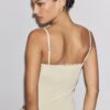Body med detaljer i blond spets Body med detaljer i blond spets