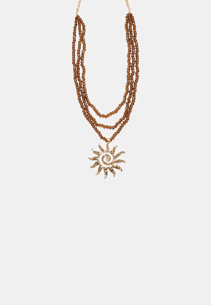 Halsband med pärlor i form av en sol Halsband med pärlor i form av en sol