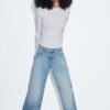 Lågmidjade jeans med Wide Leg och stjärndetalj Lågmidjade jeans med Wide Leg och stjärndetalj