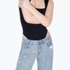 Lågmidjade jeans med Wide Leg och strass Lågmidjade jeans med Wide Leg och strass