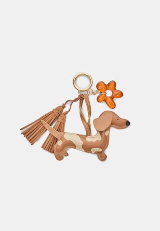 Nyckelring med hund- och blomsterberlock
