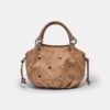 Rund crossbody-väska med ögondetaljer