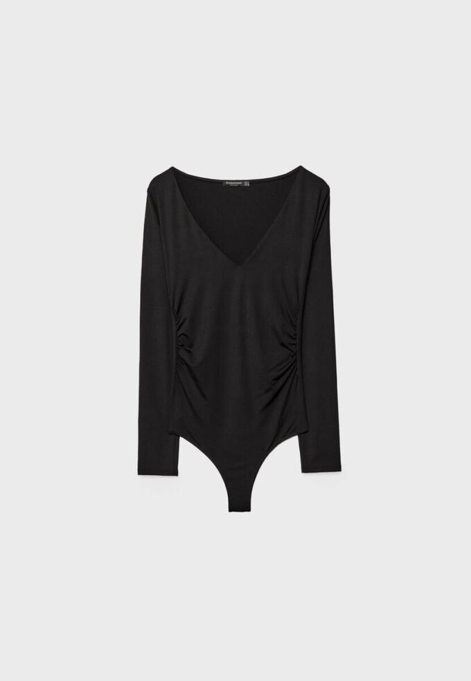 Rynkad bodysuit i polyamid med V-ringning