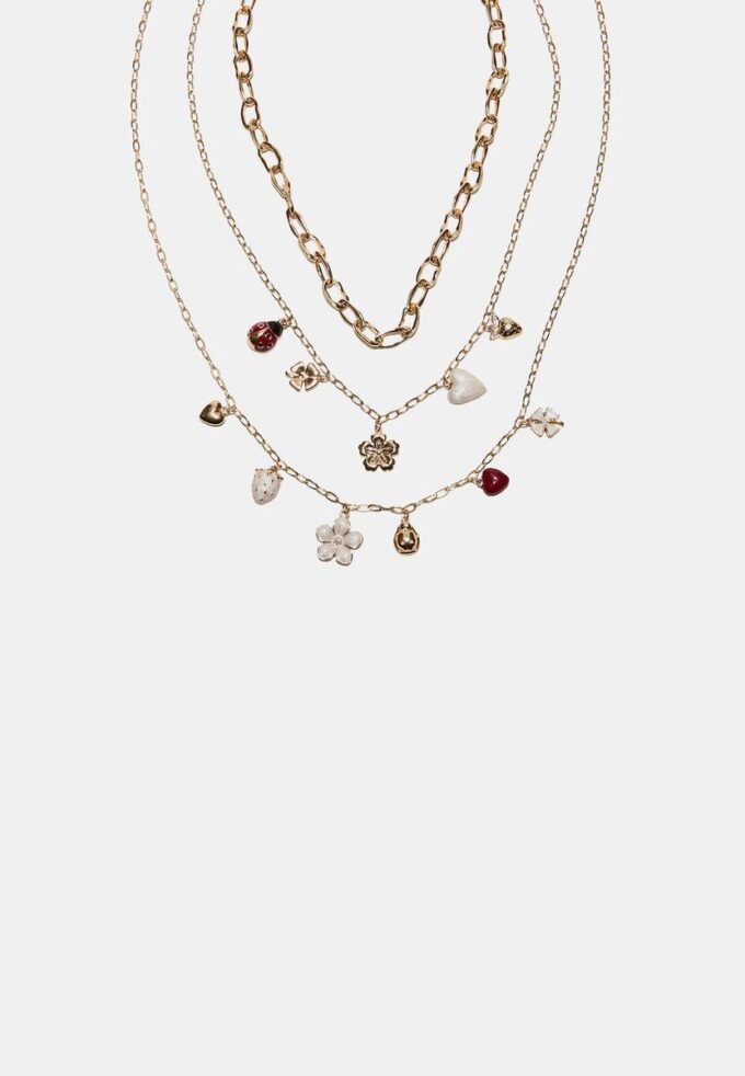 Set med 3 halsband med flera berlocker
