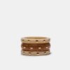 Set med 3 styva armband med nitar