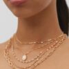 Set med 5 halsband med rosa stenar