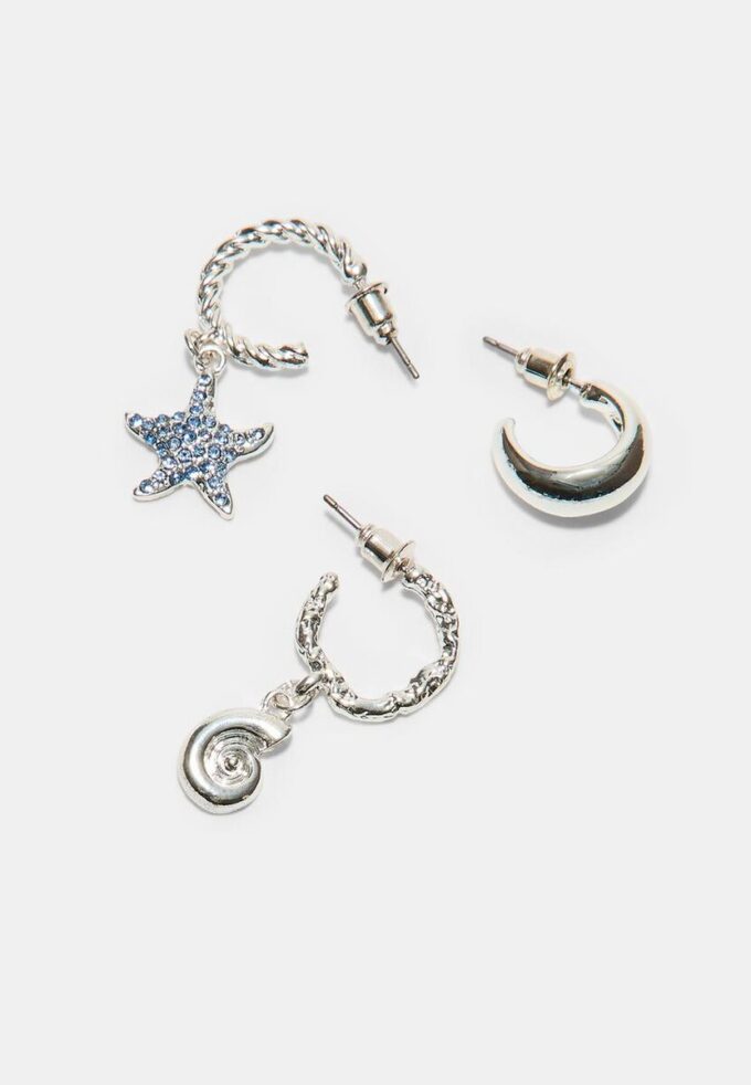 Set med 9 örhängen med strass och sjöstjärnor