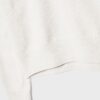 Soft Touch-basplagg med stickade detaljer