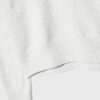Soft Touch-basplagg med stickade detaljer